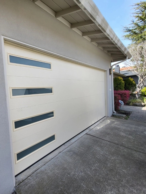 white garage door installed in a residential house